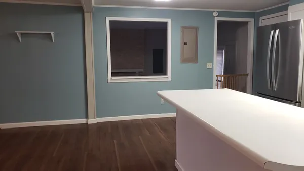 a room with a wooden floor and closet