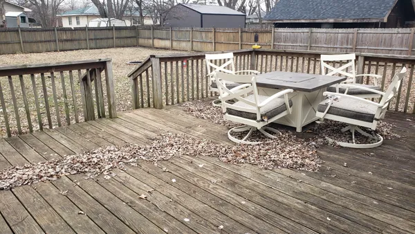 a view of a chairs with wooden deck