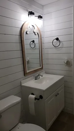 a bathroom with a sink and mirror