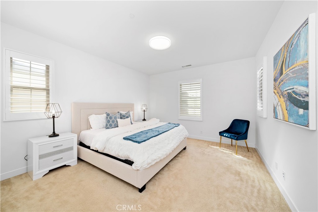 64 Hazelton Irvine, CA 92620 - Photo 14 of 20 a bedroom with a bed and a couch