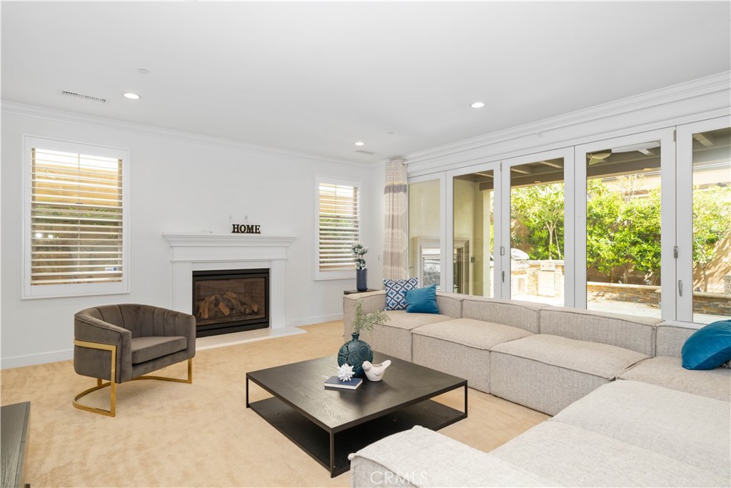 64 Hazelton Irvine, CA 92620 - Photo 2 of 20 a living room with furniture and a fireplace
