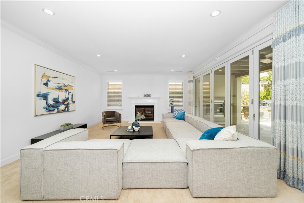 64 Hazelton Irvine, CA 92620 - Photo 3 of 20 a living room with furniture and a fireplace