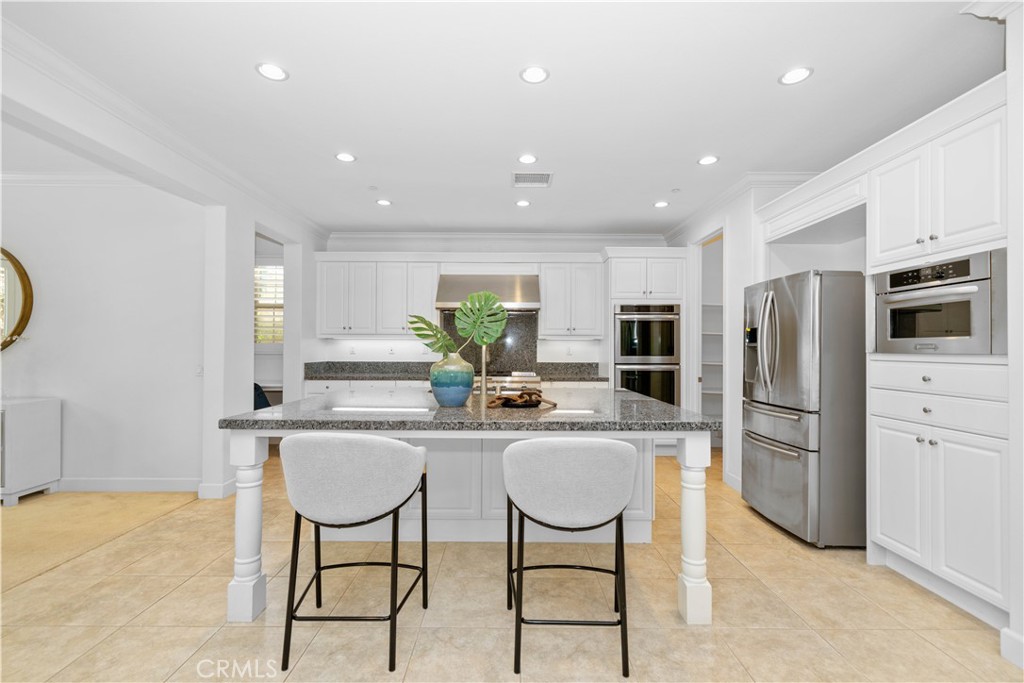 64 Hazelton Irvine, CA 92620 - Photo 4 of 20 a kitchen with refrigerator and microwave