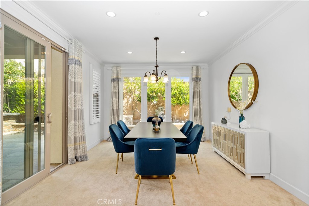 64 Hazelton Irvine, CA 92620 - Photo 5 of 20 a dining room with furniture a chandelier and a rug