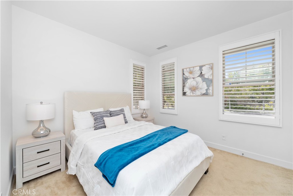 64 Hazelton Irvine, CA 92620 - Photo 7 of 20 a bedroom with a bed and a window