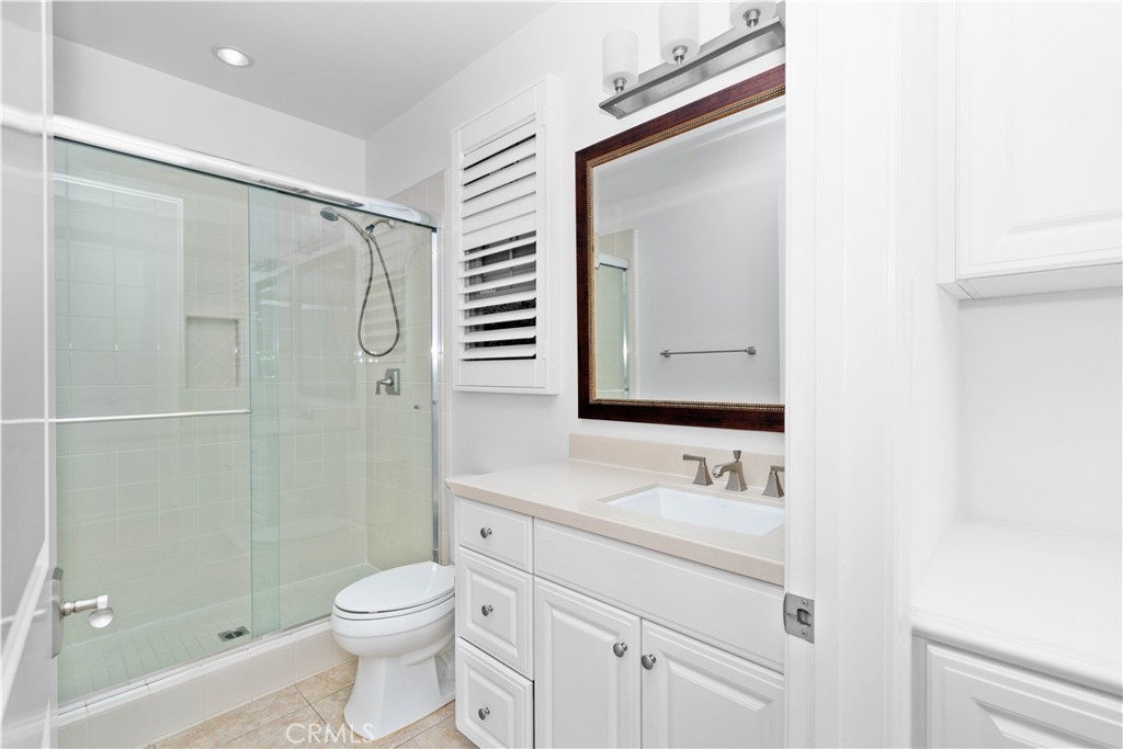 64 Hazelton Irvine, CA 92620 - Photo 8 of 20 a bathroom with a sink a toilet and shower