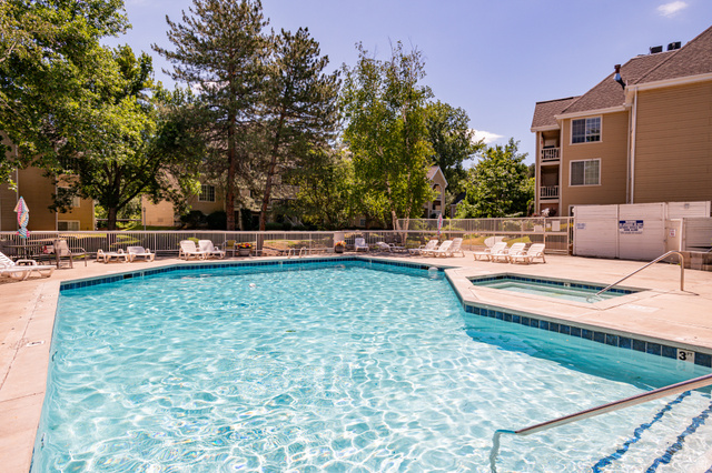 1221 Waterside Cove, Unit 11 Midvale, UT 84047 - Photo 17 of 23 Outdoor swimming pool with integrated spa and concrete surround
