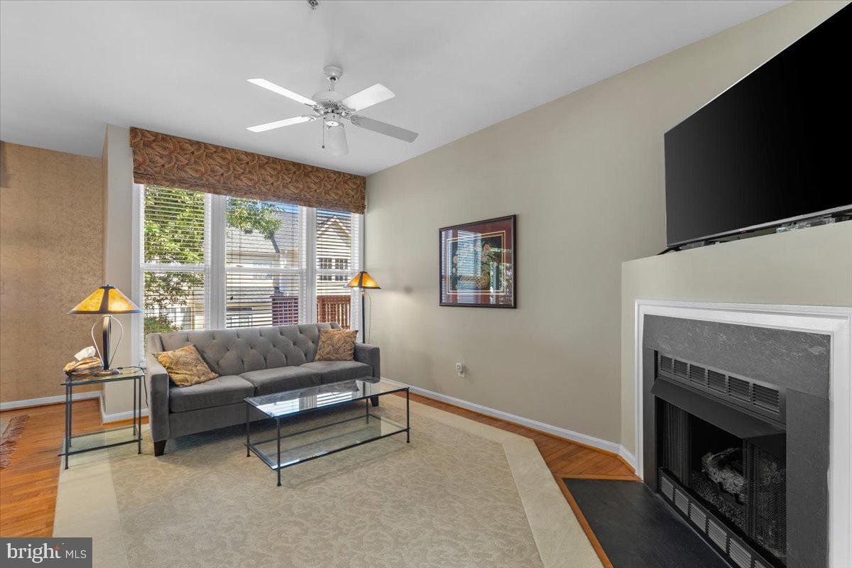 46134 Brisbane Square Sterling, VA 20165 - Photo 11 of 48 a living room with furniture and a fireplace