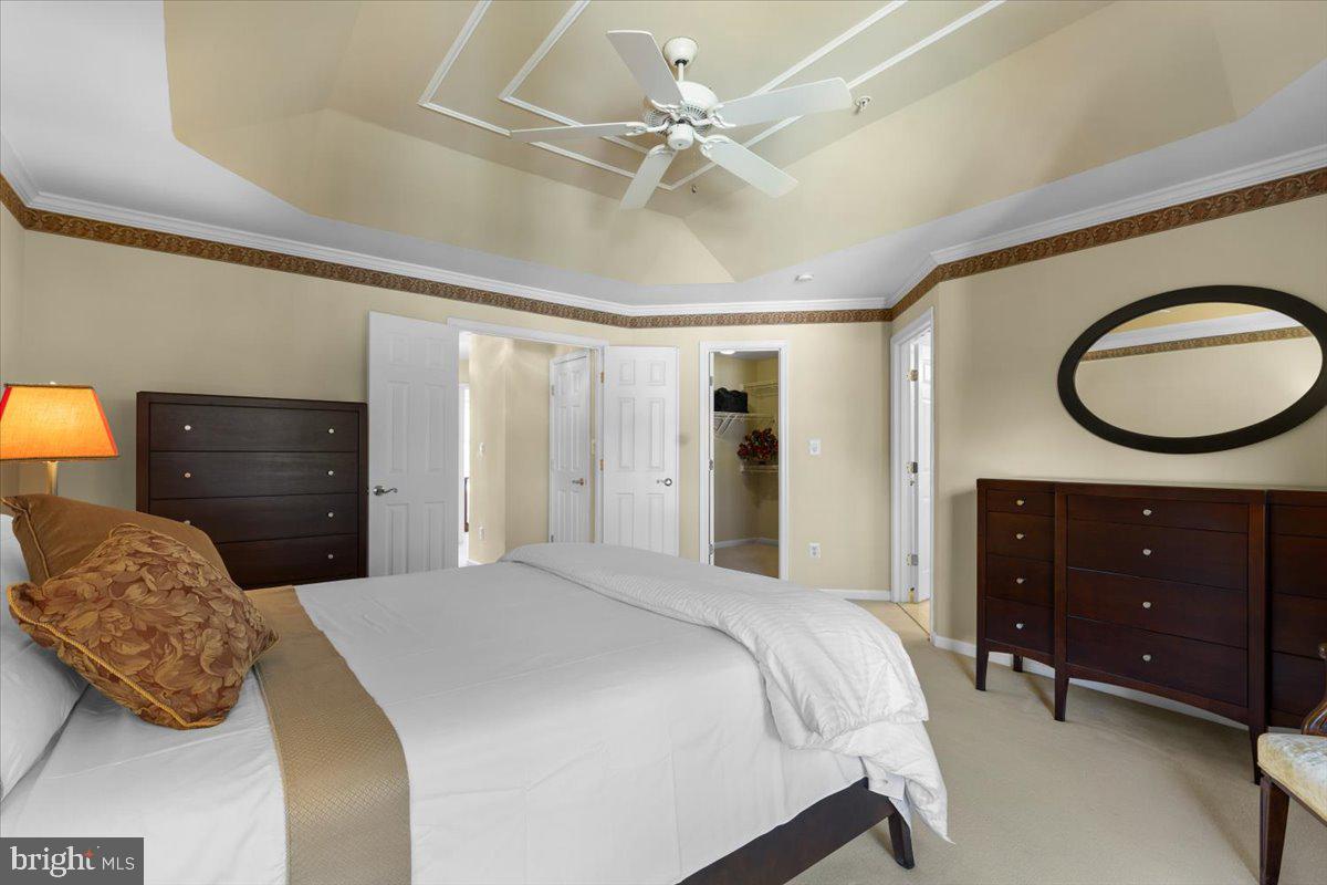 46134 Brisbane Square Sterling, VA 20165 - Photo 24 of 48 a bedroom with a bed and a dresser