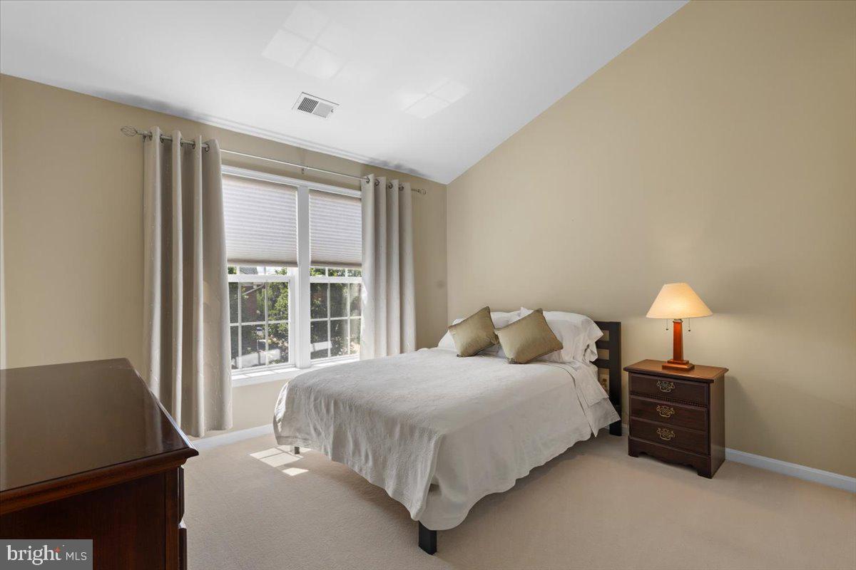 46134 Brisbane Square Sterling, VA 20165 - Photo 29 of 48 a bedroom with a bed next to a window