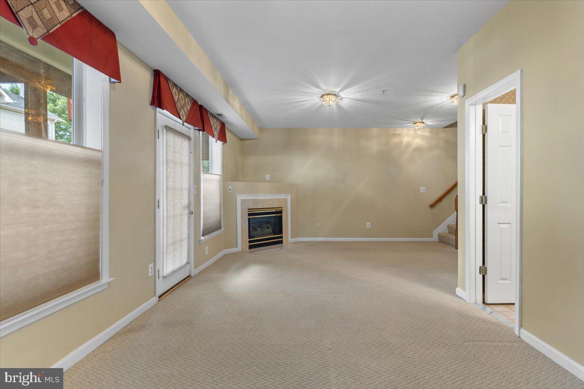 46134 Brisbane Square Sterling, VA 20165 - Photo 35 of 48 a view of empty room with fireplace