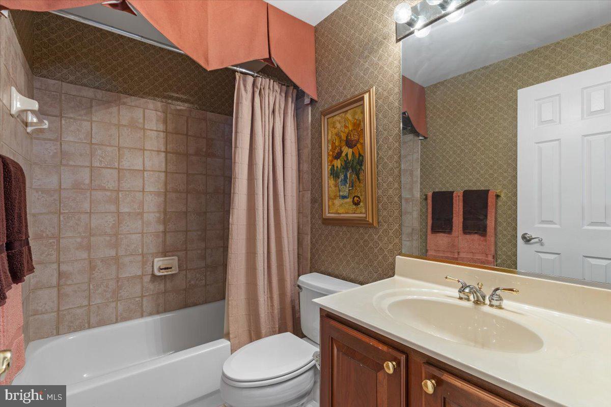 46134 Brisbane Square Sterling, VA 20165 - Photo 38 of 48 a bathroom with a sink a toilet and shower