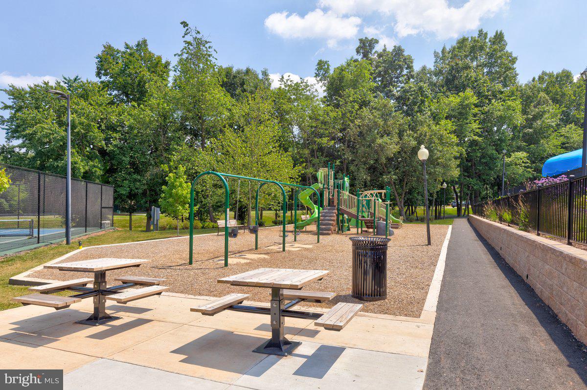 46134 Brisbane Square Sterling, VA 20165 - Photo 47 of 48 a view of a patio with a table and chairs