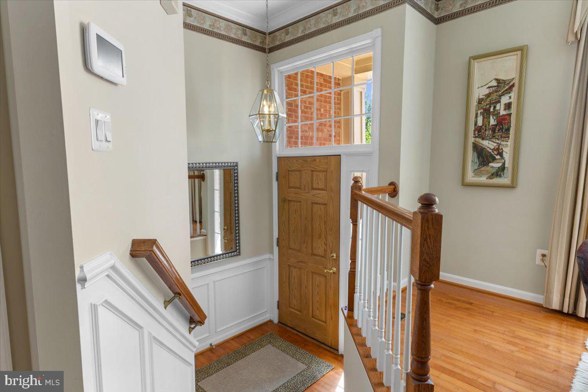 46134 Brisbane Square Sterling, VA 20165 - Photo 5 of 48 a view of front door with wooden floor