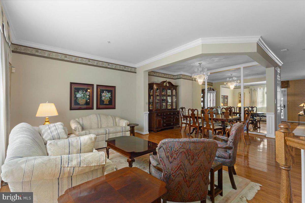 46134 Brisbane Square Sterling, VA 20165 - Photo 7 of 48 a living room with furniture and wooden floor