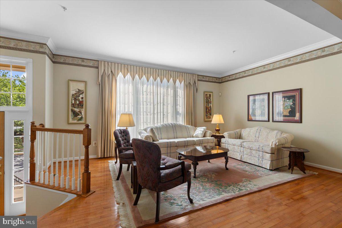 46134 Brisbane Square Sterling, VA 20165 - Photo 9 of 48 a living room with furniture and a wooden floor