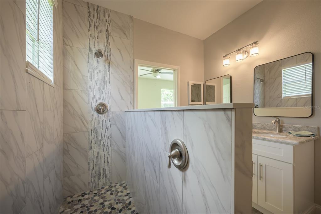 6227 Blue Runner Court Lakewood Ranch, FL 34202 - Photo 24 of 46 a bathroom with a sink and mirror