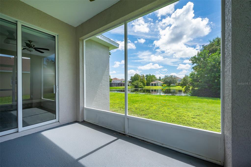 6227 Blue Runner Court Lakewood Ranch, FL 34202 - Photo 35 of 46 a view of a garden from a windows room