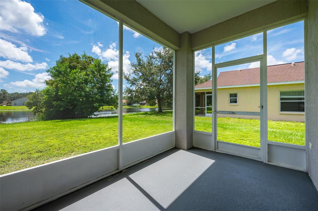 6227 Blue Runner Court Lakewood Ranch, FL 34202 - Photo 36 of 46 a view of an outdoor space with a large window