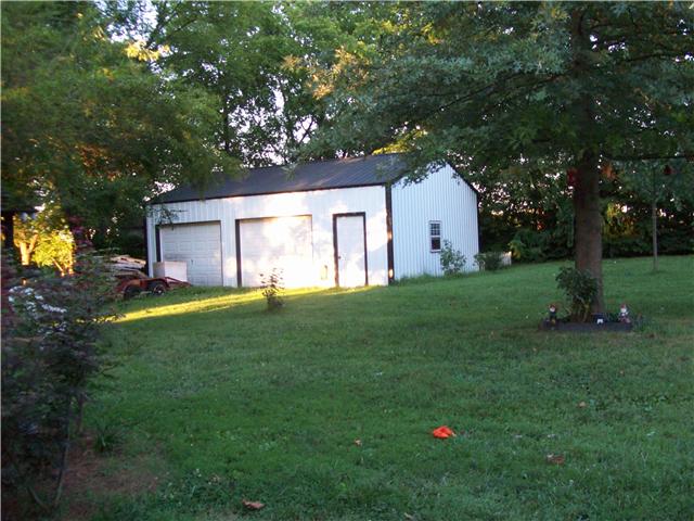 320 Jackson Road Portland, TN 37148 - Photo 15 of 20 24x30 Garage/Shop with concrete floors, electricity, insulated ceiling and industrial storage shelves. Every mans dream!