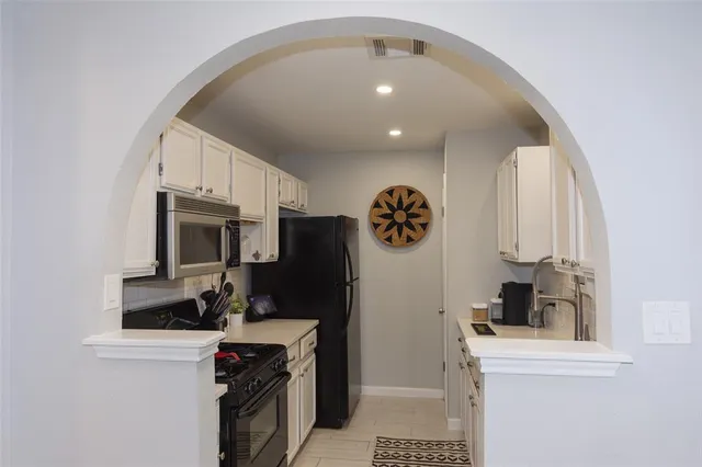 a kitchen with a stove and a microwave
