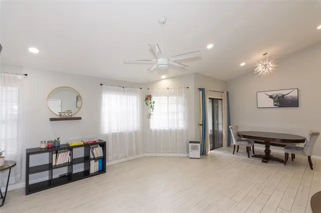 a view of a dining room with furniture and window