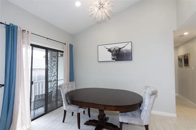 a view of a balcony with chair and potted plant