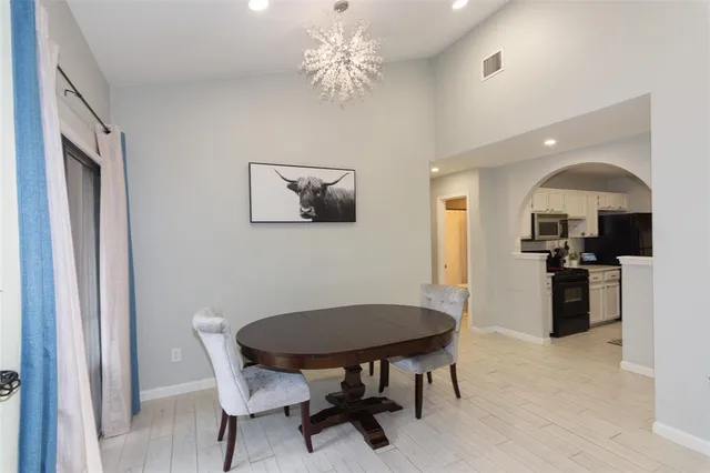 a kitchen with stainless steel appliances a stove and a refrigerator