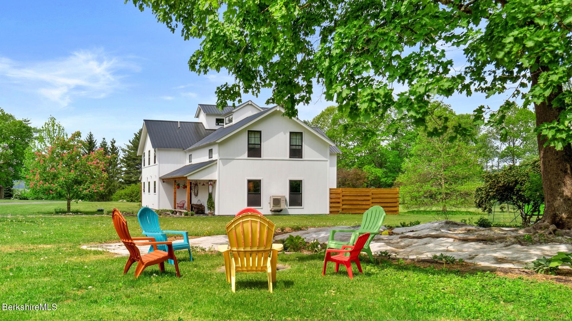 22 B Prospect Hill Road Stockbridge, MA 01262 - Photo 40 of 43 a backyard of a house with table and chairs