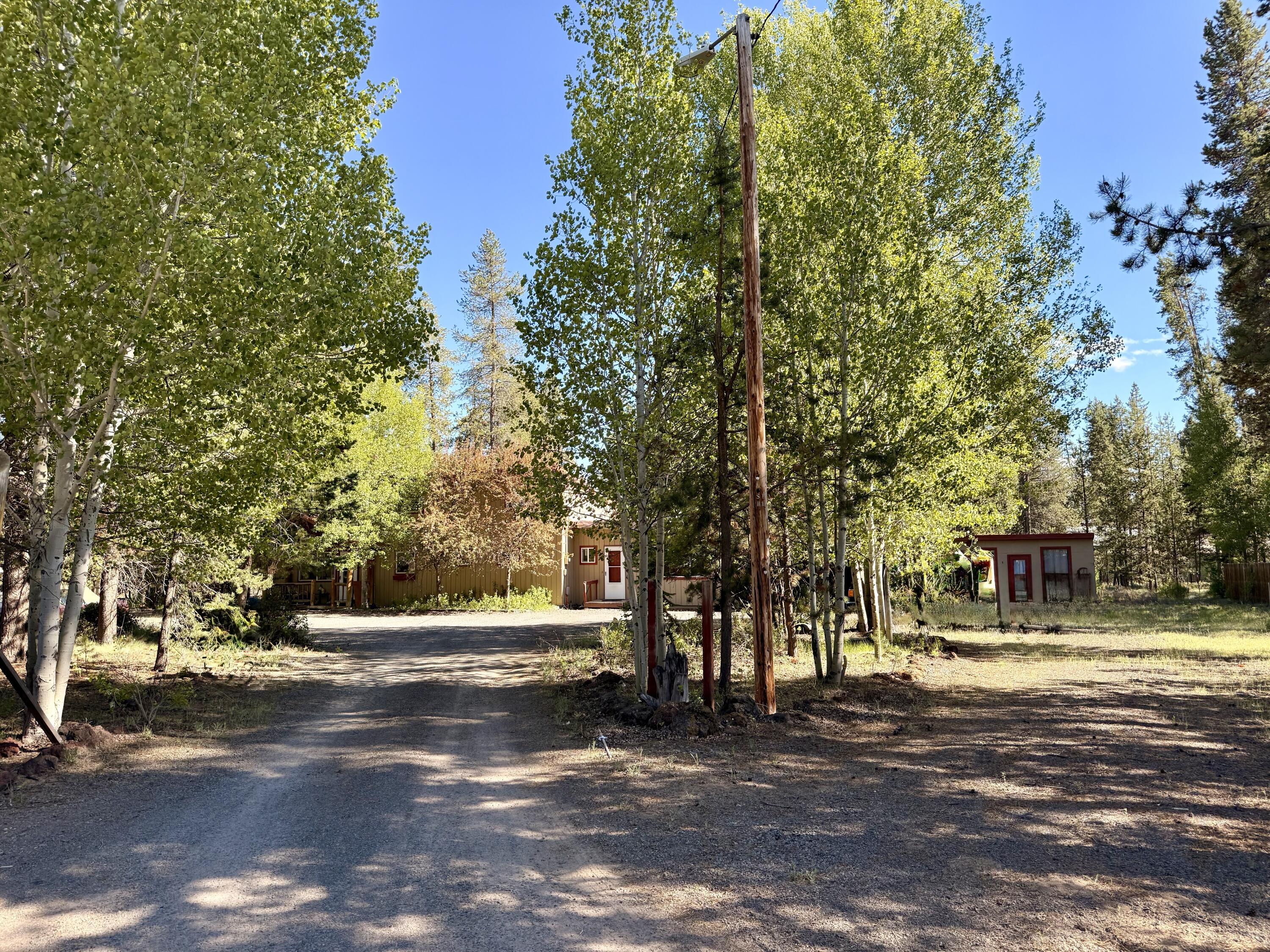 16025 Strawn Road La Pine, OR 97739 - Photo 2 of 95 a view of road with trees