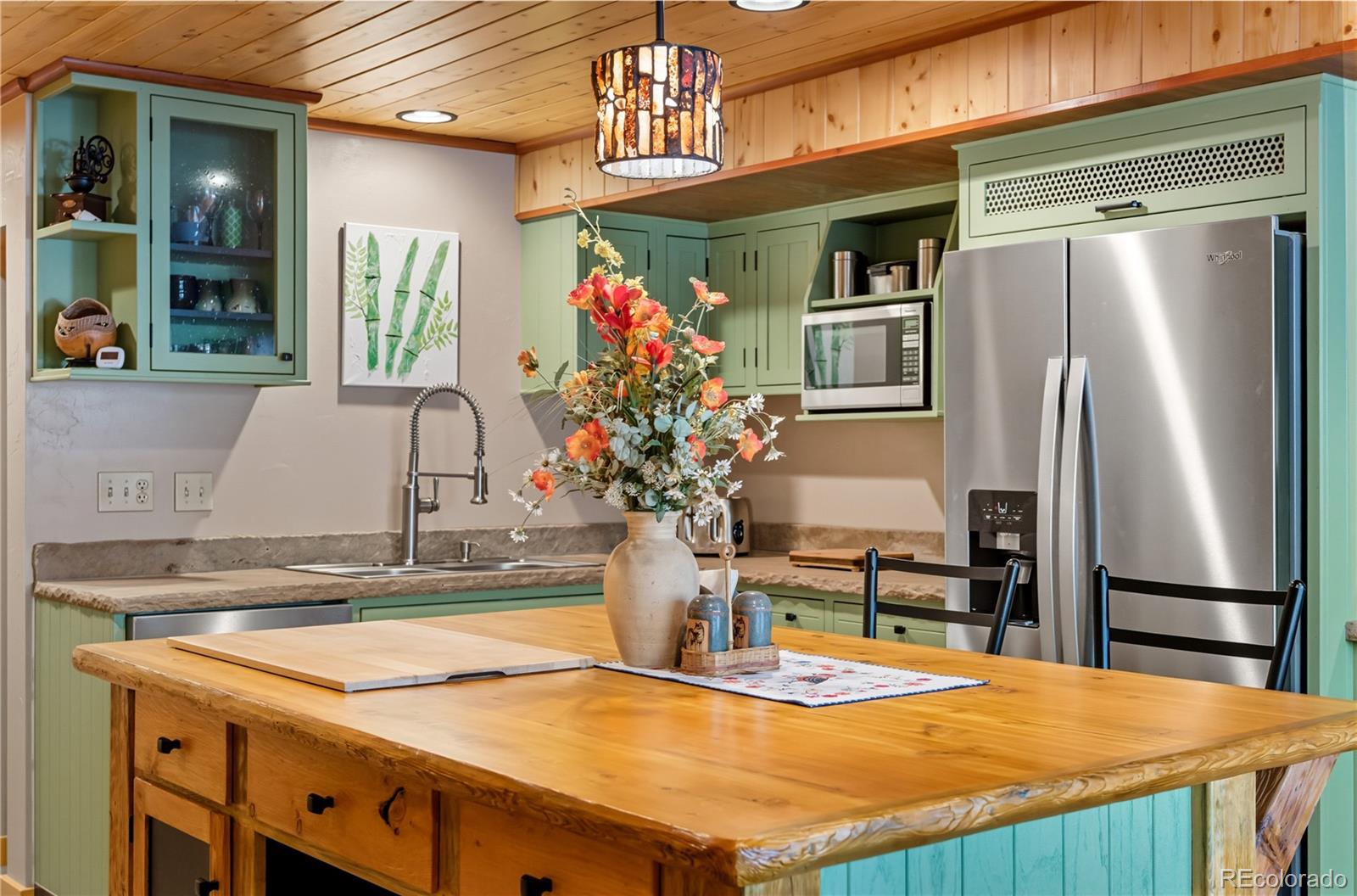 401 Lake Road Idaho Springs, CO 80452 - Photo 25 of 47 a kitchen with stainless steel appliances granite countertop a refrigerator and a stove