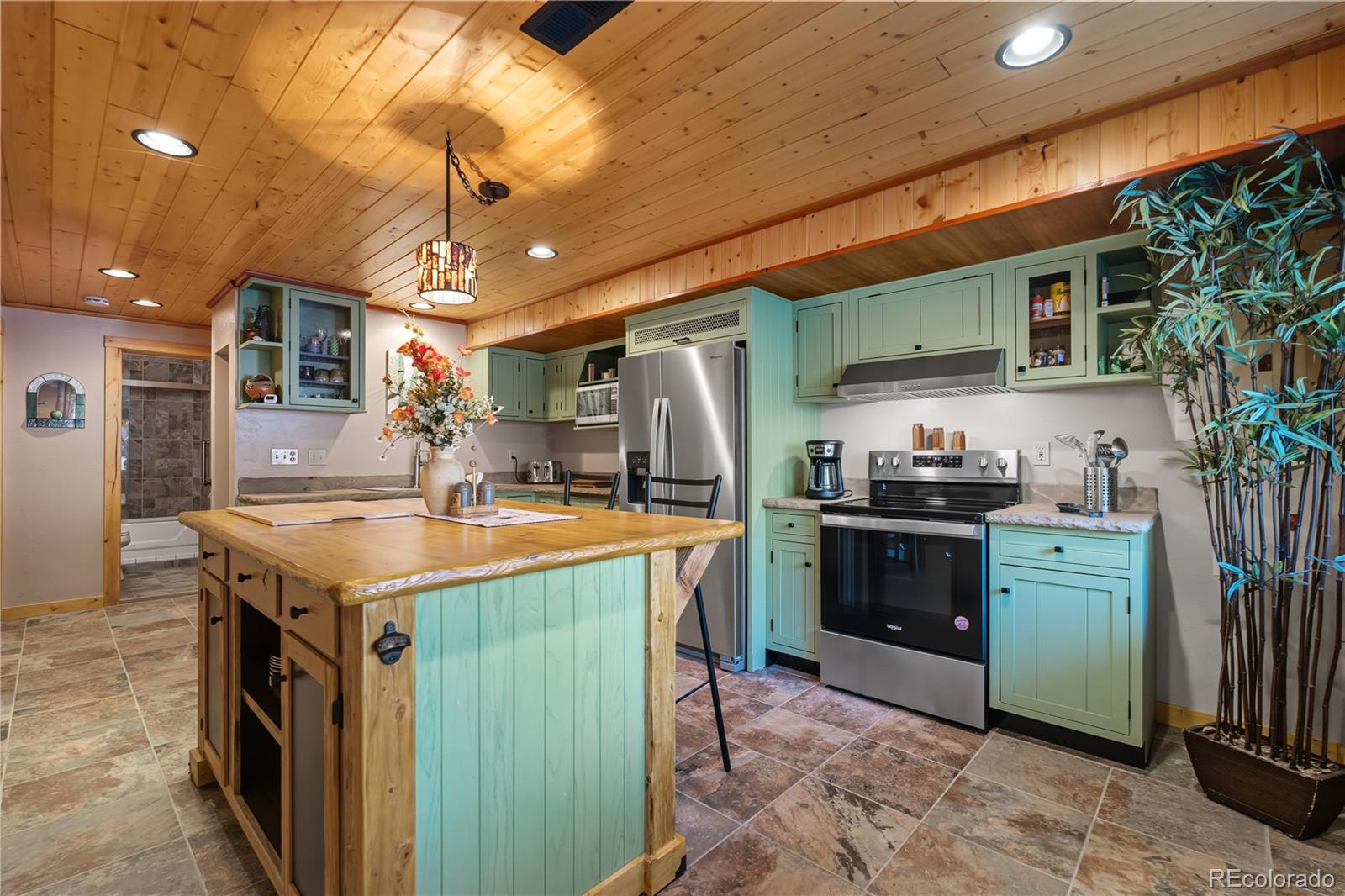 401 Lake Road Idaho Springs, CO 80452 - Photo 26 of 47 a kitchen with a sink and refrigerator