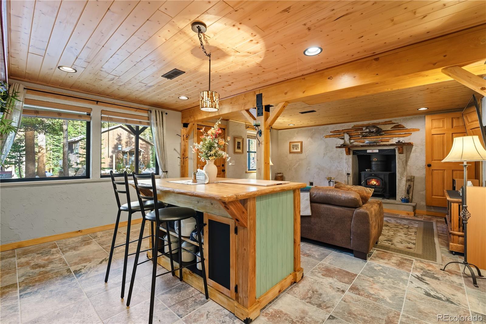 401 Lake Road Idaho Springs, CO 80452 - Photo 28 of 47 a view of a dining room with furniture window and wooden floor