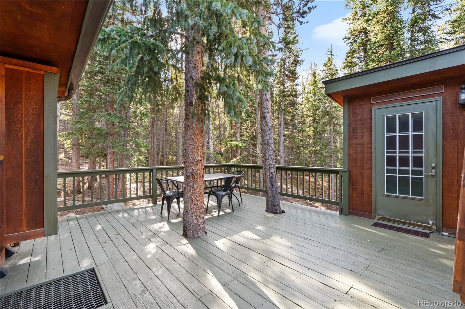 401 Lake Road Idaho Springs, CO 80452 - Photo 33 of 47 a view of a balcony with chairs and wooden floor