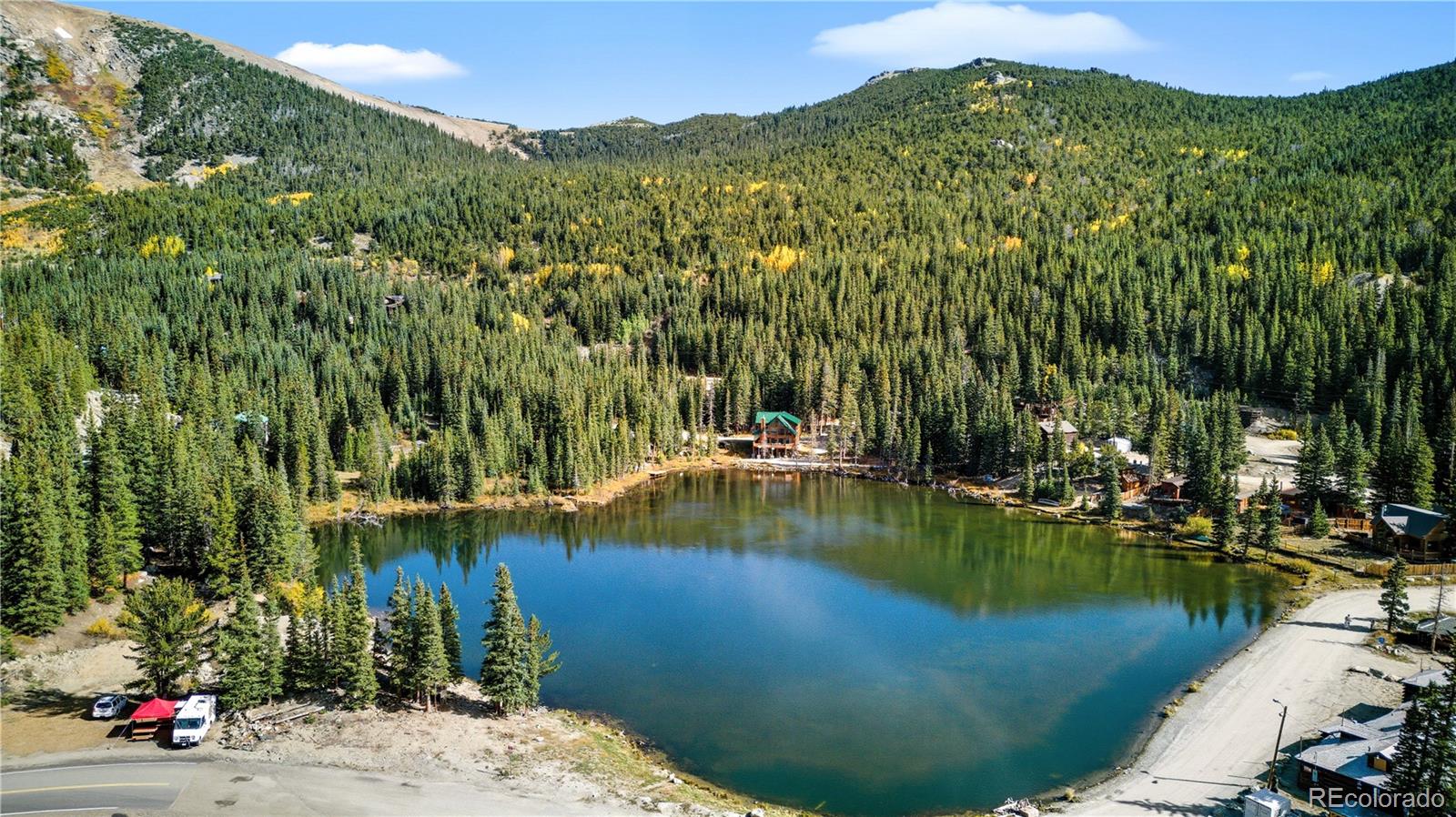 401 Lake Road Idaho Springs, CO 80452 - Photo 42 of 47 a view of a lake with a mountain in the background