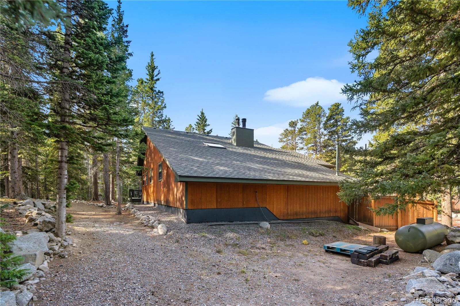 401 Lake Road Idaho Springs, CO 80452 - Photo 43 of 47 a view of a house with a backyard