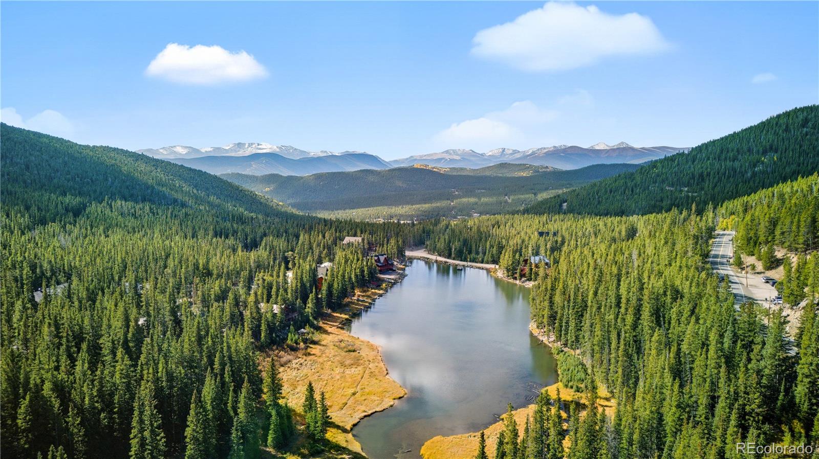 401 Lake Road Idaho Springs, CO 80452 - Photo 6 of 47 a view of a lake with a mountain in the background
