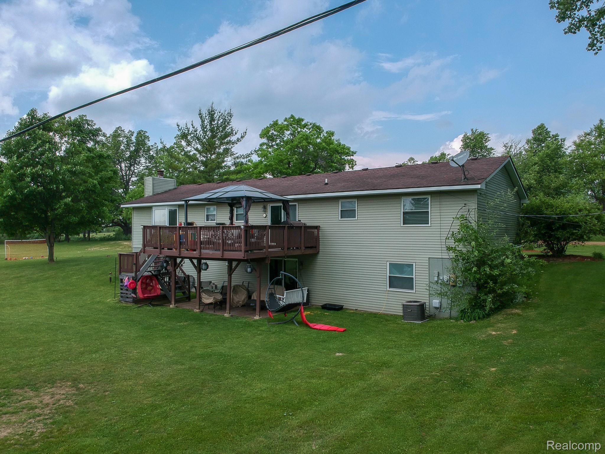 10250 County Line Road Ortonville, MI 48462 - Photo 29 of 41 Back of house.jpg
