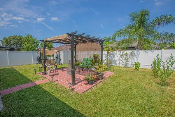 a view of a backyard with a patio