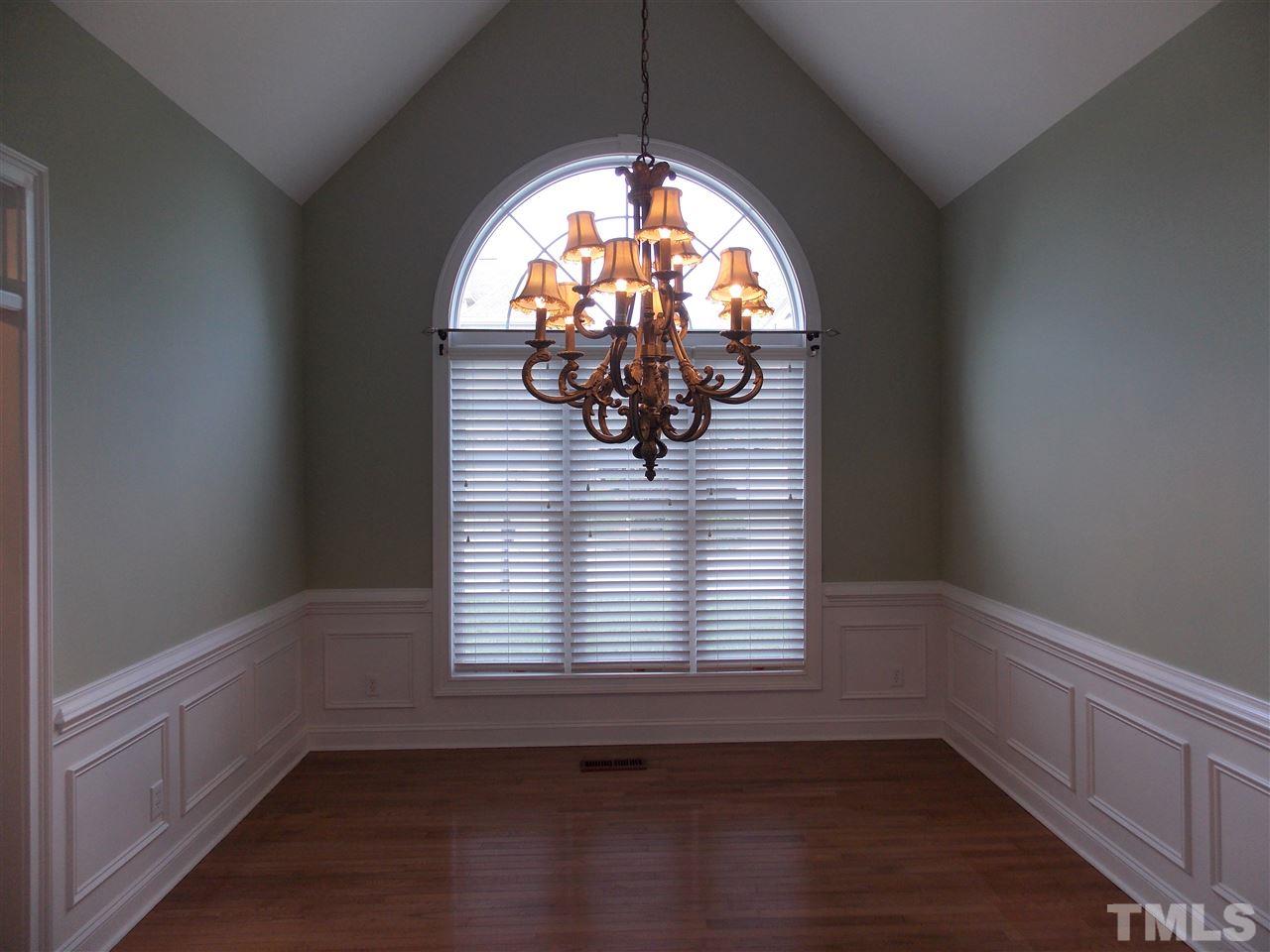 12233 Beestone Lane Raleigh, NC 27614 - Photo 2 of 25 an empty room with wooden floor and windows