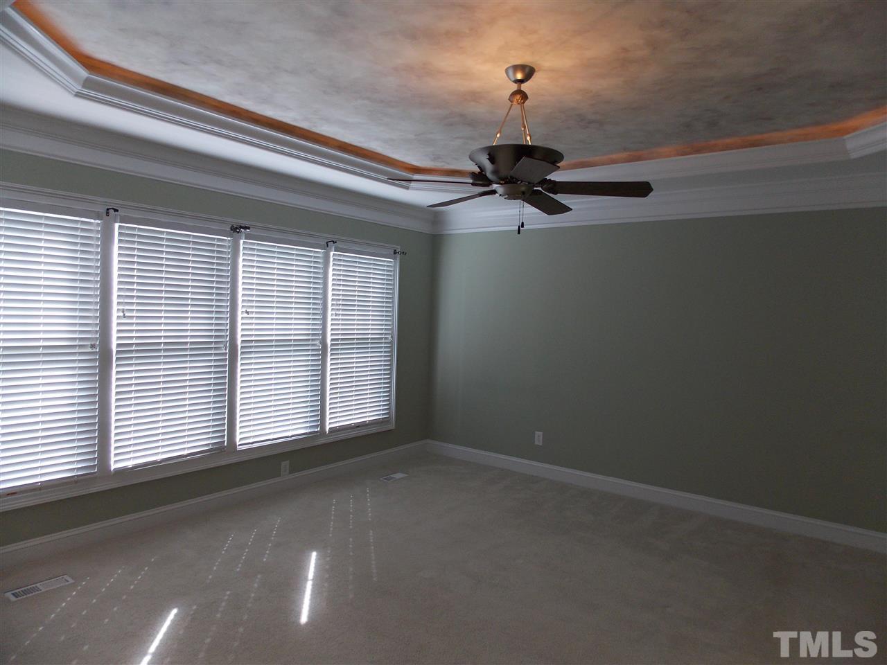 12233 Beestone Lane Raleigh, NC 27614 - Photo 12 of 25 a view of a livingroom with a ceiling fan and window