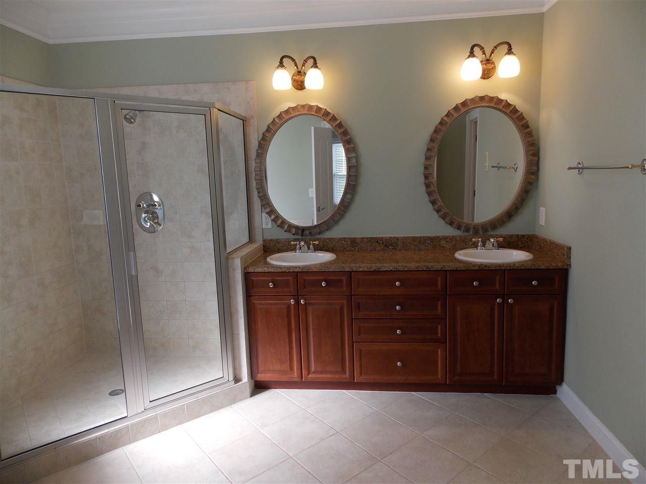 12233 Beestone Lane Raleigh, NC 27614 - Photo 13 of 25 a bathroom with a mirror and a sink