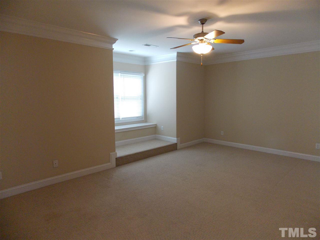 12233 Beestone Lane Raleigh, NC 27614 - Photo 18 of 25 en empty room with windows and fan