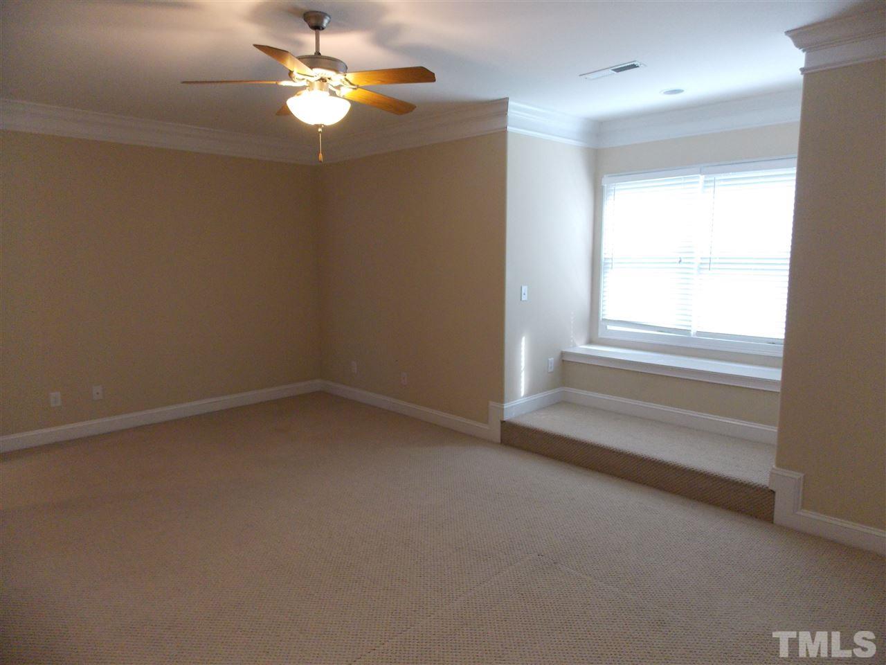 12233 Beestone Lane Raleigh, NC 27614 - Photo 19 of 25 a view of room with a ceiling fan and window
