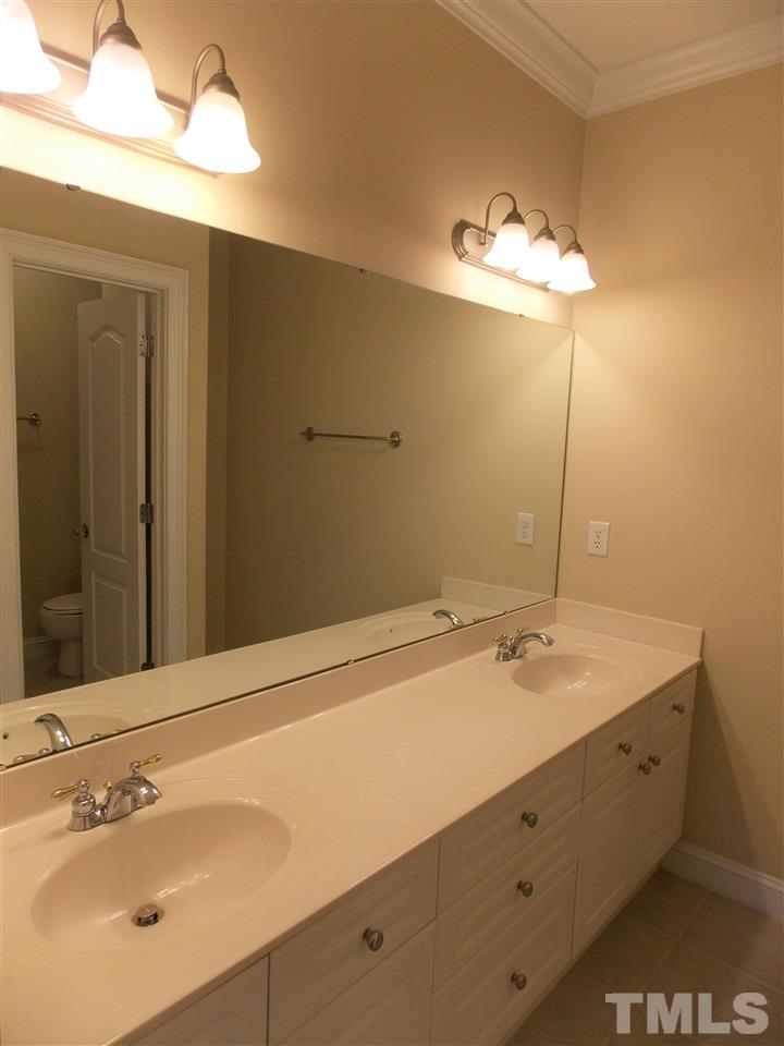 12233 Beestone Lane Raleigh, NC 27614 - Photo 20 of 25 a bathroom with a sink and a mirror