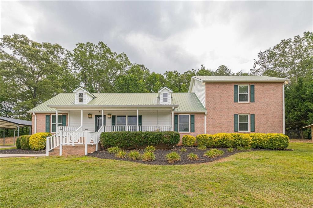 5021 Elrod Road Gainesville, GA 30506 - Photo 1 of 1 a view of a house with a big yard potted plants and large tree