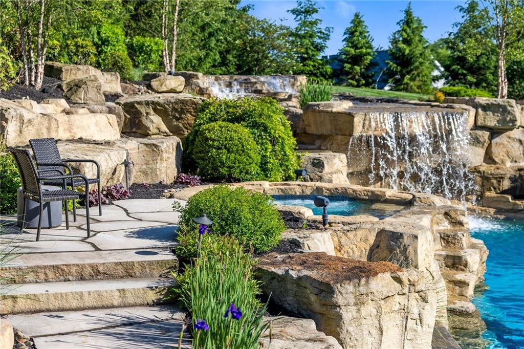 435 Myoma Road Mars, PA 16046 - Photo 43 of 50 Dramatic pool landscape with cascading rock waterfalls and mature plantings for a secluded resort ambiance.