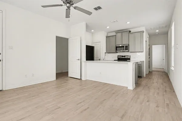 a view of kitchen with wooden floor