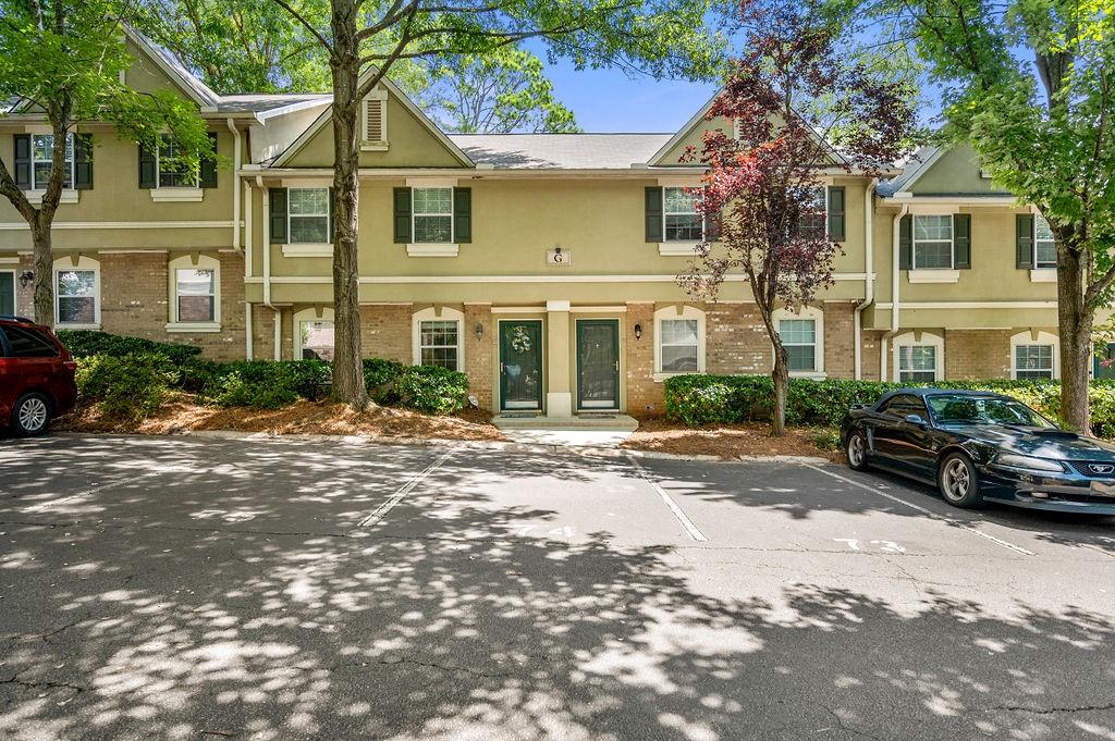 6900 Roswell Road, Unit G3 Atlanta, GA 30328 - Photo 1 of 1 a view of a parked cars in front of a building