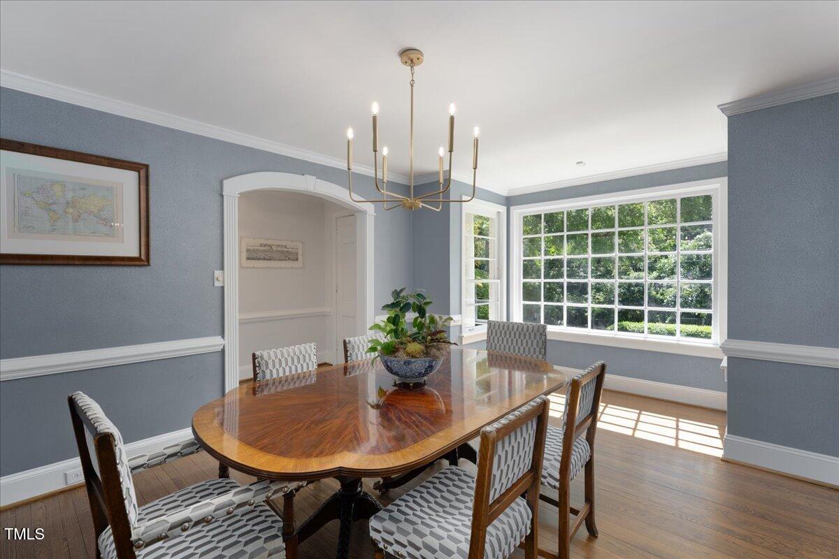2803 Exeter Circle Raleigh, NC 27608 - Photo 5 of 38 a view of a dining room with furniture window and wooden floor
